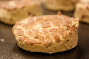 Delicious uncooked cinnamon roll on a pan waiting to be cooked