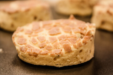 Delicious uncooked cinnamon roll on a pan waiting to be cooked