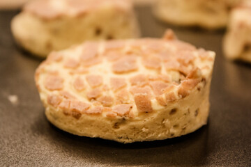 Delicious uncooked cinnamon roll on a pan waiting to be cooked
