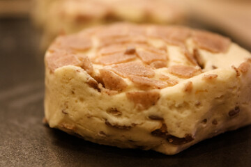 Delicious uncooked cinnamon roll on a pan waiting to be cooked