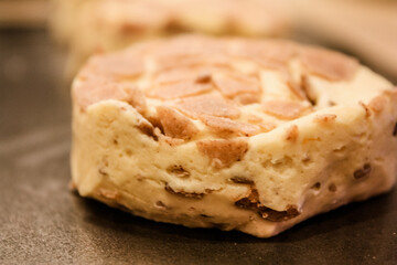 Delicious uncooked cinnamon roll on a pan waiting to be cooked