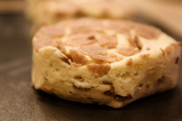 Delicious uncooked cinnamon roll on a pan waiting to be cooked