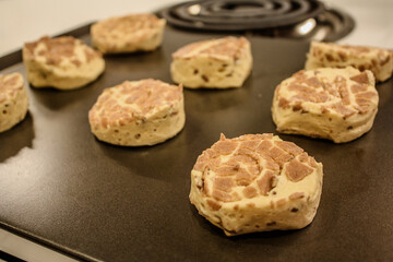 Delicious uncooked cinnamon roll on a pan waiting to be cooked