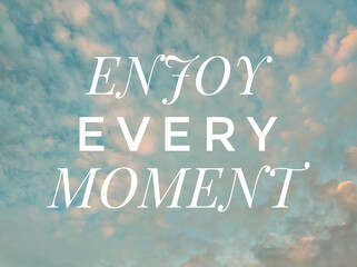 Text ENJOY EVERY MOMENT with nature background.Motivation quote.