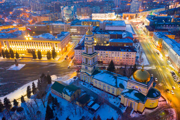View from drone of illuminated Cathedral of Nativity of Christ on main square in Russian city of Lipetsk on winter evening..