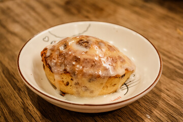 Delicious hot cinnamon roll with icing