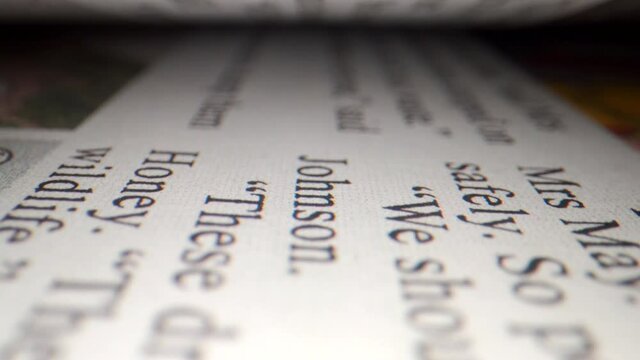The lens passes through the opened page, and macro close-up