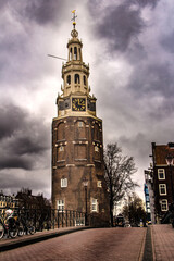 old tower near a bridge and over the canal in Amsterdam