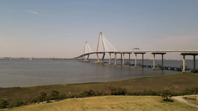 Large bridge Over the River aerial view sunny dat blue sky with traffic boats and 