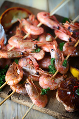 Shrimp kebabs. Grilled shrimp on sticks. Delicious shrimp with spices and lemon.