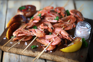 Shrimp kebabs. Grilled shrimp on sticks. Delicious shrimp with spices and lemon.