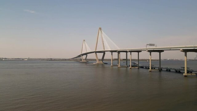Large bridge Over the River aerial view sunny dat blue sky with traffic boats and 