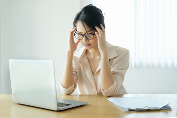 new normal, a businesswoman useing  computer to work for a company Via the internet on your desk at home