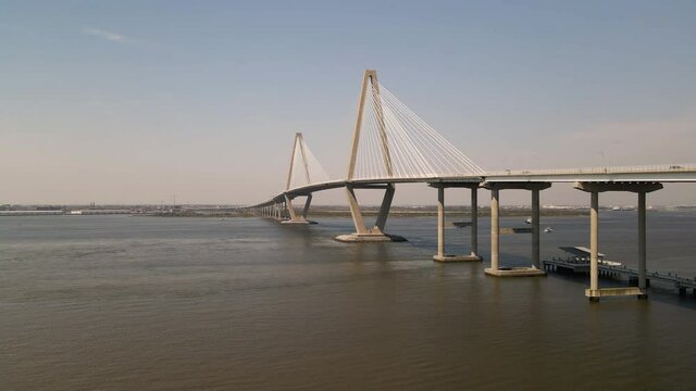 Large bridge Over the River aerial view sunny dat blue sky with traffic boats and 