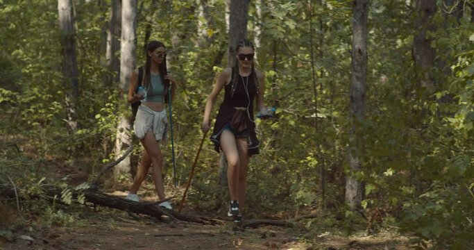 Two girls walking trough the forest