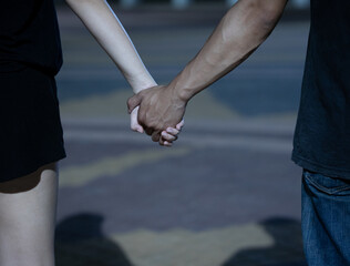 Close up view of romantic couple in love holding hands.
valentine's day. Love story and Romantic concept.