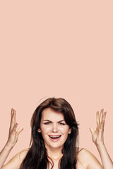 Portrait of aggressive mad crazy brunette screaming on color background, The stereotypes are...