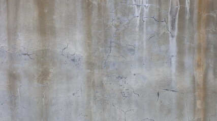 Old concrete wall background with rust stains. Grunge and disgusting raw concrete backgrounds or textures with stains for background work. Selective focus