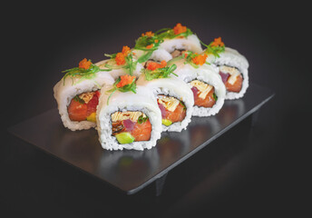 Sushi roll fresh salmon, tuna, eel, avocado, wrapped in thinly sliced scallop
