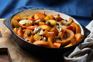 Baked carrots, sweet potatoes, fennel, turnips, chili, pumpkin, garlic and thyme in a cast iron skillet