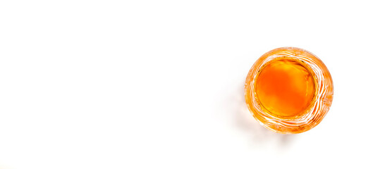 Scotch Whiskey without ice in glass, white background with hard light, copy space