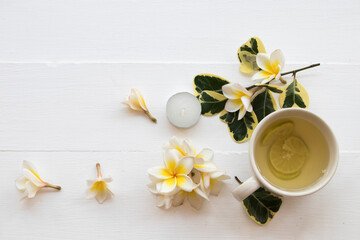 herbal healthy drinks hot honey lemon health care for cough sore with flowers frangipani arrangement flat lay style on background white wooden