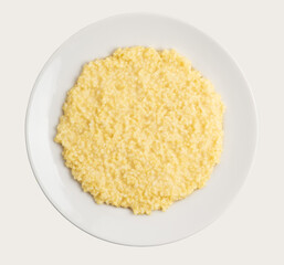 millet bright yellow porridge on an white plate