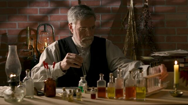 Scene from the 19th century of a mature experienced apothecary in his private laboratory mixing different chemicals to formulate medicinal remedies.