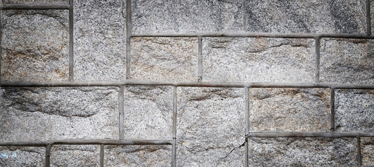 Texture of a stone wall. Old castle stone wall texture background. Stone wall as a background or texture. Part of a stone wall, for background or texture, banner