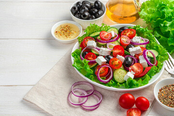 Fresh vegetable salad. Greek salad on a wooden background.