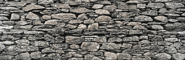 Dry stone wall in the Lake District showing rocks with colour and texture