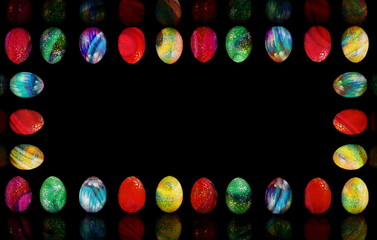 Fototapeta na wymiar beautiful colorful easter eggs on a black background