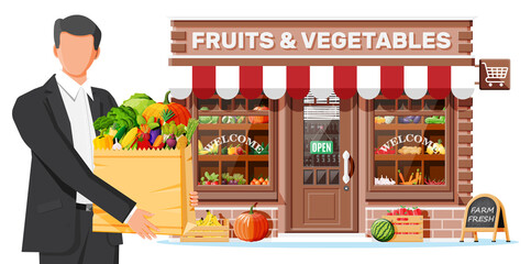 Fruit and vegetable store facade with man