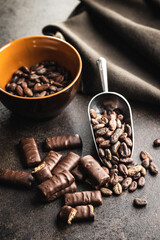 Chocolate bars with nuts filling and cocoa beans.