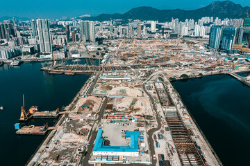 Obraz premium Top view at large construction sites and many cranes are working in the, Industry new building business.