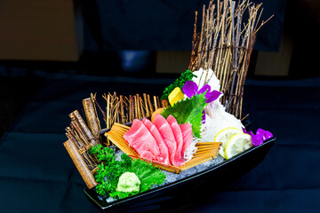 Beef tuna in sashimi set with iced lemon and orchids Japanese food