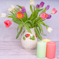 Blooming tulips, candles, Easter eggs, Happy Easter concept, Happy Easter.