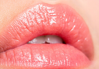 Close-up beautiful lips. Sexy plump lips nude lipstick. Close-up perfect natural lip makeup...
