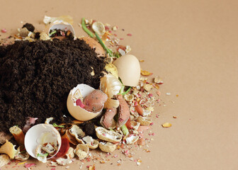 Organic waste, heap of biodegradable vegetable compost with decomposed organic matter on top isolated on beige, closeup, zero waste, eco friendly, waste recycling and natural fertilizer concept