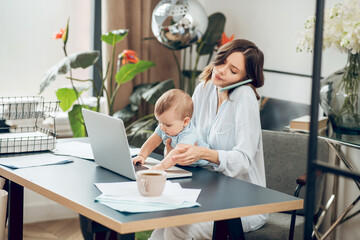 Small child disturbing mom at work home place