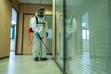 Fumigator sanitizing, cleaning and disinfection. Coronavirus pandemic professional control.