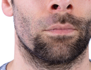 Fototapeta premium Closeup of a partly shaven face