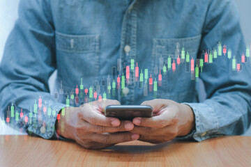 Concept digital money and stock business, Business men use smartphone with bar graph of stock and stock table
