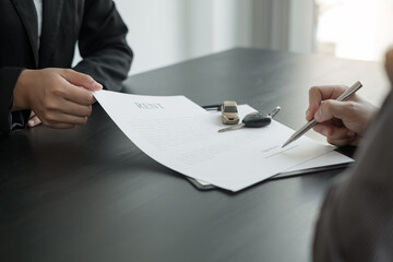 The car dealer provides advice on loans, insurance details, and car rental information, and...