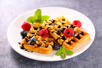waffles with berries fruits and chocolate