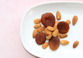 Dry fruits and almonds, top view, apricots dried naturally