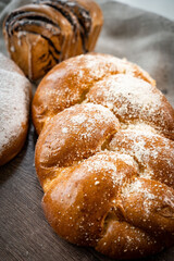 loaf of bread on wooden background, food closeup