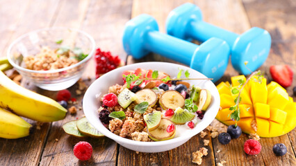 diet food concept- breakfast and dumbbell