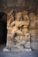 Fototapeta na wymiar Dvarapalas (gate guardians) of east wing shrine, Elephanta Caves, Cave 1, at Elephanta Island or Gharapuri, Mumbai, Maharashtra, India
