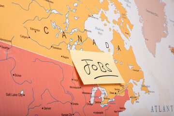  jobs word sticky note attached with the Canada country on world map